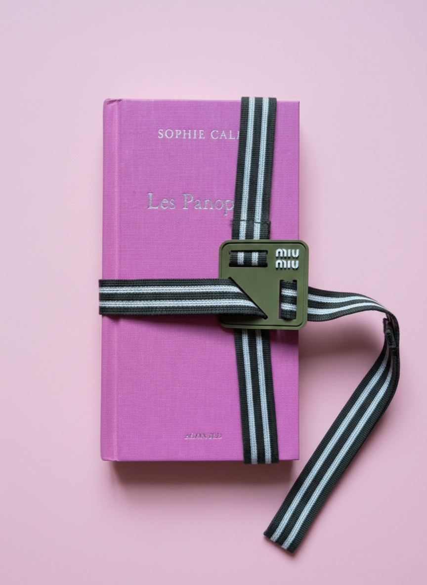 Miu Miu reads book strap